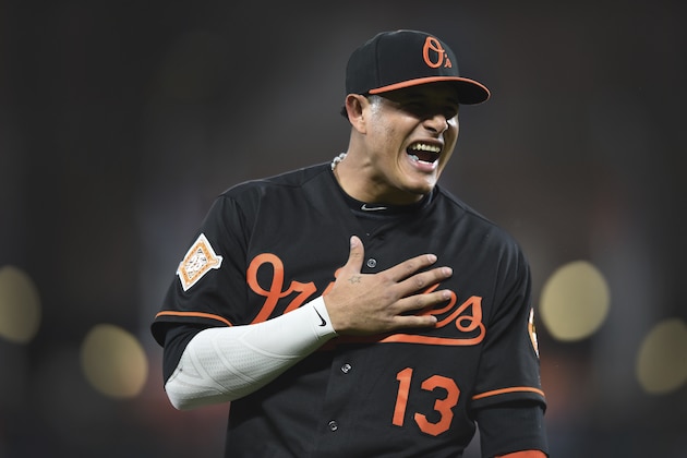 Baltimore Orioles' Manny Machado reacts to something from the bench of the Tampa Bay Rays before a baseball game, Friday, Sept. 22, 2017, in Baltimore. (AP Photo/Gail Burton)