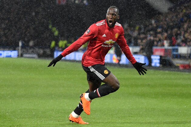 Manchester United's Belgian striker Romelu Lukaku celebrates scoring the opening goal of the English FA Cup fifth round football match between Huddersfield Town and Manchester United at the John Smith's stadium in Huddersfield, northern England on February 17, 2018. / AFP PHOTO / Oli SCARFF / RESTRICTED TO EDITORIAL USE. No use with unauthorized audio, video, data, fixture lists, club/league logos or 'live' services. Online in-match use limited to 75 images, no video emulation. No use in betting, games or single club/league/player publications.  /         (Photo credit should read OLI SCARFF/AFP/Getty Images)