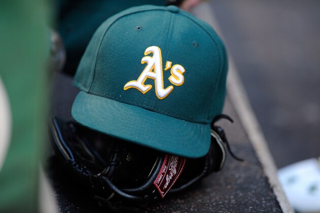 BALTIMORE, MD - AUGUST 15:  An Oakland Athletics hat and glove on the steps of the dugout during the game against the Baltimore Orioles at Oriole Park at Camden Yards on August 15, 2015 in Baltimore, Maryland.  (Photo by G Fiume/Getty Images)