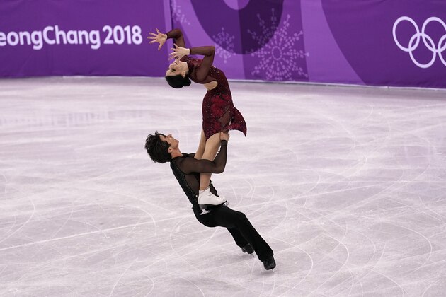 GANGNEUNG, SOUTH KOREA - FEBRUARY 12:  Tessa Virtue and Scott Moir of Canada compete in the Figure Skating Team Event ? Ice Dance Free Dance on day three of the PyeongChang 2018 Winter Olympic Games at Gangneung Ice Arena on February 12, 2018 in Gangneung, South Korea.  (Photo by XIN LI/Getty Images)