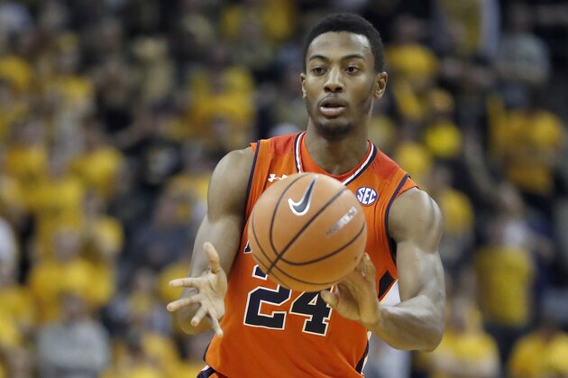 Auburn's Anfernee McLemore passes during the first half of an NCAA college basketball game against Missouri Wednesday, Jan. 24, 2018, in Columbia, Mo. (AP Photo/Jeff Roberson)