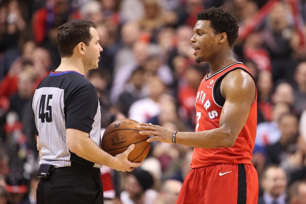 TORONTO, ON - FEBRUARY 13: Kyle Lowry #7 of the Toronto Raptors talks to referee Brian Forte #45 during their NBA game against the Miami Heat at Air Canada Centre on February 13, 2018 in Toronto, Canada. NOTE TO USER: User expressly acknowledges and agrees that, by downloading and or using this photograph, User is consenting to the terms and conditions of the Getty Images License Agreement. (Photo by Tom Szczerbowski/Getty Images)