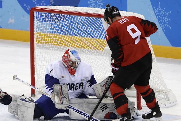 Goalie Matt Dalton (1), of South Korea, deflects the puck as Derek Roy (9), of Canada, tries to shoot during the third period of the preliminary round of the men's hockey game at the 2018 Winter Olympics in Gangneung, South Korea, Sunday, Feb. 18, 2018. (AP Photo/Matt Slocum) Goalie Matt Dalton (1), of South Korea, deflects the puck as Derek Roy (9), of Canada, tries to shoot during the third period of the preliminary round of the men's hockey game at the 2018 Winter Olympics in Gangneung, South Korea, Sunday, Feb. 18, 2018. (AP Photo/Matt Slocum)