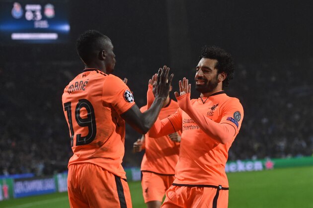 Liverpool's Senegalese midfielder Sadio Mane (L) celebrates with Liverpool's Egyptian midfielder Mohamed Salah after scoring their third goal during the UEFA Champions League round of sixteen first leg football match between FC Porto and Liverpool at the Dragao stadium in Porto, Portugal on February 14, 2018.
Liverpool won the game 5-0. / AFP PHOTO / Francisco LEONG        (Photo credit should read FRANCISCO LEONG/AFP/Getty Images)