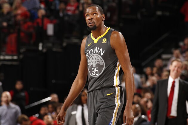 PORTLAND, OR - FEBRUARY 14:  Kevin Durant #35 of the Golden State Warriors looks on during the game against the Portland Trail Blazers on February 14, 2018 at the Moda Center in Portland, Oregon. NOTE TO USER: User expressly acknowledges and agrees that, by downloading and or using this Photograph, user is consenting to the terms and conditions of the Getty Images License Agreement. Mandatory Copyright Notice: Copyright 2018 NBAE (Photo by Cameron Browne/NBAE via Getty Images)