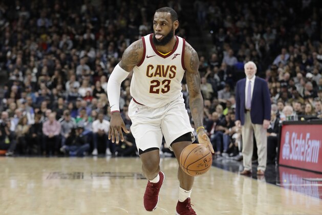 Cleveland Cavaliers forward LeBron James (23) brings the ball up court during the first half of an NBA basketball game against the San Antonio Spurs, Tuesday, Jan. 23, 2018, in San Antonio. James entered the game needing seven points to hit the 30,000 mark for career points; James scored 28 points. (AP Photo/Eric Gay)
