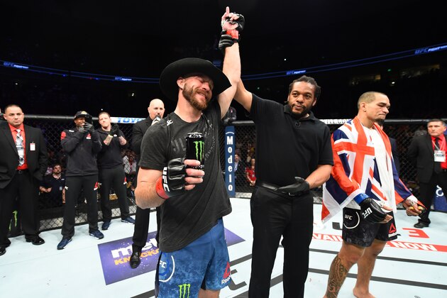 AUSTIN, TX - FEBRUARY 18:  Donald Cerrone (L) celebrates after defeating Yancy Medeiros by KO in their welterweight bout during the UFC Fight Night event at Frank Erwin Center on February 18, 2018 in Austin, Texas.  (Photo by Josh Hedges/Zuffa LLC/Zuffa LLC via Getty Images)