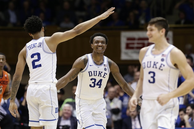 Duke's Gary Trent Jr. (2), Grayson Allen (3) and celebrate with Wendell Carter Jr. (34) celebrate following Carter's basket against Virginia Tech during the second half of an NCAA college basketball game in Durham, N.C., Wednesday, Feb. 14, 2018. Duke won 74-52. (AP Photo/Gerry Broome)