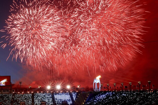 Fireworks detonate after the Olympic flame was lit during the opening ceremony of the 2018 Winter Olympics in Pyeongchang, South Korea, Friday, Feb. 9, 2018. (Sean Haffey/Pool Photo via AP)