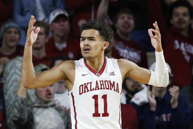 Oklahoma guard Trae Young (11) gestures following a call in the first half of an NCAA college basketball game against Texas in Norman, Okla., Saturday, Feb. 17, 2018. (AP Photo/Sue Ogrocki)