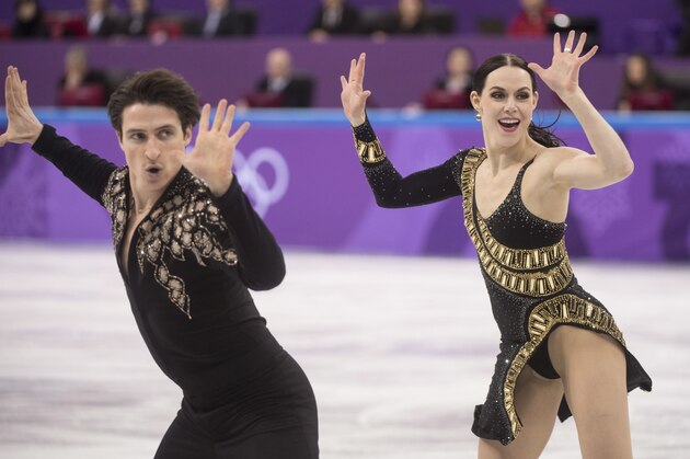 Canada's Tessa Virtue and Scott Moir perform their routine during the ice dance short program in the team figure skating event at the Pyeonchang Winter Olympics Sunday, February 11, 2018 in Gangneung, South Korea. (Paul Chiasson/The Canadian Press via AP)
