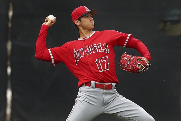 Los Angeles Angels' Shohei Ohtani throws during a spring training baseball practice on Wednesday, Feb. 14, 2018, in Tempe, Ariz. (AP Photo/Ben Margot)