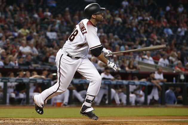 Arizona Diamondbacks' J.D. Martinez watches the flight of his home run against the San Francisco Giants during the ninth inning of a baseball game Wednesday, Sept. 27, 2017, in Phoenix. The Diamondbacks defeated the Giants 4-3. (AP Photo/Ross D. Franklin)