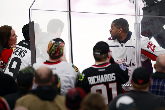 Washington Capitals right wing Devante Smith-Pelly (25) argues with Chicago Blackhawks fans from the penalty box during the third period of an NHL hockey game Saturday, Feb. 17, 2018, in Chicago. The Blackhawks won 7-1. (AP Photo/Jeff Haynes)