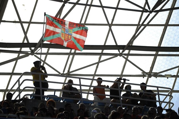 A man waves a Basque flag during a demonstration organised by pro-independence platform Gure Esku Dago (It's in our hands) at the Anoeta stadium  in San Sebastian on June 21, 2015. Thousands of people formed a human chain in Pamplona/Bilbao/San Sebastian in support of a regional referendum on the Basque country's indpendence from Spain.   AFP PHOTO/ ANDER GILLENEA        (Photo credit should read ANDER GILLENEA/AFP/Getty Images)