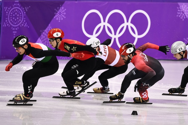(L-R) Hungary's Sandor Liu Shaolin, China's Wu Dajing, Latvia's Roberto Pukitis, Canada's Charles Hamelin and Latvia's Roberts Janis Zvejnieks compete in the men's 1,000m short track speed skating quarter-final event during the Pyeongchang 2018 Winter Olympic Games, at the Gangneung Ice Arena in Gangneung on February 17, 2018. / AFP PHOTO / ARIS MESSINIS        (Photo credit should read ARIS MESSINIS/AFP/Getty Images)
