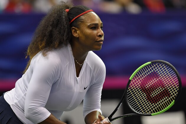 ASHEVILLE, NC - FEBRUARY 11: Serena Williams of Team USA waits on a serve from Lesley Kerkhove and Demi Schuurs of the Netherlands during a  doubles match in the first round of the 2018 Fed Cup at US Cellular Center on February 11, 2018 in Asheville, North Carolina. (Photo by Richard Shiro/Getty Images)
