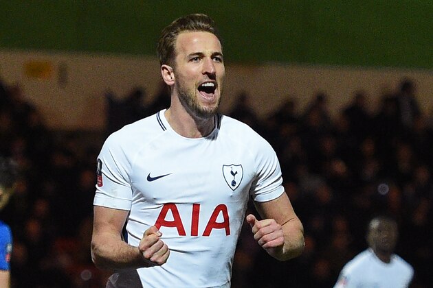 Tottenham Hotspur's English striker Harry Kane celebrates after scoring their second goal from the penalty spot during the English FA Cup fifth round football match between Rochdale and Tottenham Hotspur at the Crown Oil Arena in Rochdale, north west England on February 18, 2018.
The game ended 2-2. / AFP PHOTO / Oli SCARFF / RESTRICTED TO EDITORIAL USE. No use with unauthorized audio, video, data, fixture lists, club/league logos or 'live' services. Online in-match use limited to 75 images, no video emulation. No use in betting, games or single club/league/player publications.  /         (Photo credit should read OLI SCARFF/AFP/Getty Images)