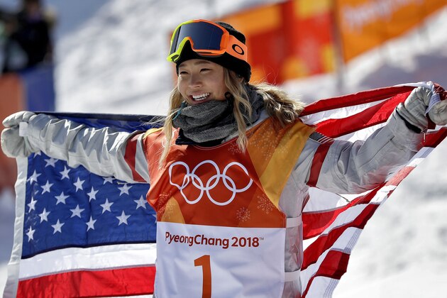 FILE- In this Feb. 13, 2018, file photo, Chloe Kim, of the United States, celebrates winning gold after the women's halfpipe finals at Phoenix Snow Park at the 2018 Winter Olympics in Pyeongchang, South Korea. Before Kim won gold in the snowboarding halfpipe event, her infectious personality and heartwarming origin story had already won her sponsorships from Toyota, Samsung, Visa and others. (AP Photo/Gregory Bull, File)