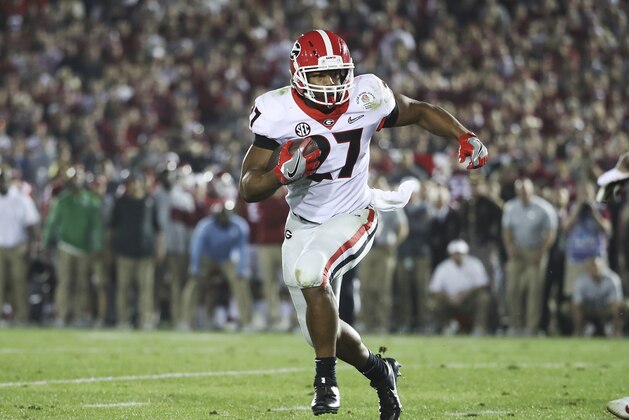 Georgia tailback Nick Chubb (27) looks for room to run on a fourth quarter touchdown against Oklahoma during the College Football Playoff Semifinal at the Rose Bowl, Monday, Jan. 1, 2018, in Pasadena, Calif. Georgia defeated Oklahoma 54-48. (AP Photo/Doug Benc)