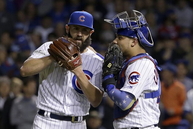 Chicago Cubs catcher Willson Contreras, right, talks to starting pitcher Jake Arrieta during the seventh inning of Game 4 of baseball's National League Championship Series against the Los Angeles Dodgers, Wednesday, Oct. 18, 2017, in Chicago. (AP Photo/Nam Y. Huh)