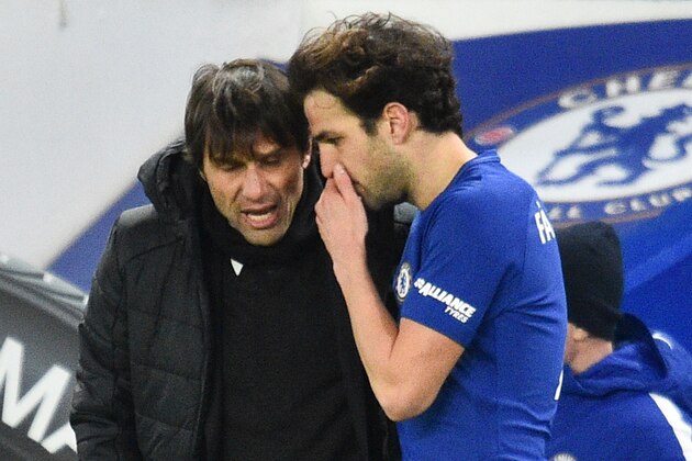 Chelsea's Italian head coach Antonio Conte talks with Chelsea's Spanish midfielder Cesc Fabregas (R) during the English Premier League football match between Chelsea and West Bromwich Albion at Stamford Bridge in London on February 12, 2018. / AFP PHOTO / Glyn KIRK / RESTRICTED TO EDITORIAL USE. No use with unauthorized audio, video, data, fixture lists, club/league logos or 'live' services. Online in-match use limited to 75 images, no video emulation. No use in betting, games or single club/league/player publications.  /         (Photo credit should read GLYN KIRK/AFP/Getty Images)