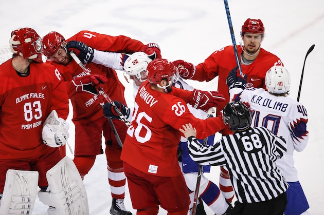 GANGNEUNG, SOUTH KOREA - FEBRUARY 21:  Olympic Athlete from Russia GAVRIKOV Vladislav (#4)  and Norway's Ludvig Hoff (#27) fight for the puck in their men's quarterfinal ice hockey match during the 2018 Winter Olympic Games, at the Gangneung Hockey Centre.  (Photo by XIN LI/Getty Images)