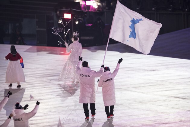 PYEONGCHANG-GUN, SOUTH KOREA - FEBRUARY 09: Flag bearers Chung Guam Hwang and Yunjong Won of Republic of Korea leads the team during the Opening Ceremony of the PyeongChang 2018 Winter Olympic Games at PyeongChang Olympic Stadium on February 9, 2018 in Pyeongchang-gun, South Korea. (Photo by XIN LI/Getty Images)