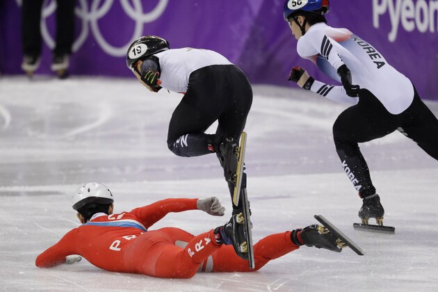 Jong Kwang Bom of North Korea crashes at the start of his men's 500 meters short track speedskating heat in the Gangneung Ice Arena at the 2018 Winter Olympics in Gangneung, South Korea, Tuesday, Feb. 20, 2018. (AP Photo/Bernat Armangue)