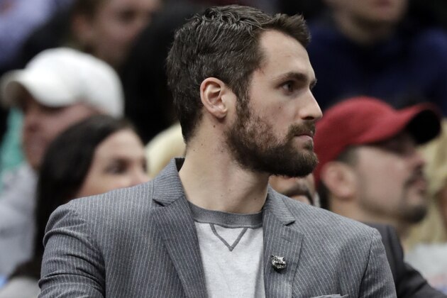 Cleveland Cavaliers' Kevin Love watches from the bench in the first half of an NBA basketball game against the Houston Rockets, Saturday, Feb. 3, 2018, in Cleveland. (AP Photo/Tony Dejak)