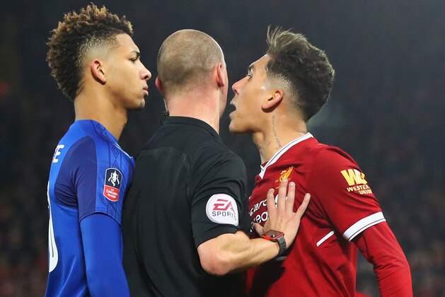 LIVERPOOL, ENGLAND - JANUARY 05:  Referee Robert Madley intervenes as Mason Holgate of Everton and Roberto Firmino of Liverpool clash during the Emirates FA Cup Third Round match between Liverpool and Everton at Anfield on January 5, 2018 in Liverpool, England.  (Photo by Clive Brunskill/Getty Images)