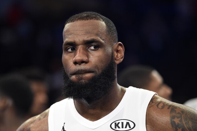 Team LeBron's LeBron James, of the Cleveland Cavaliers, looks on during the trophy ceremony following an NBA All-Star basketball game against Team Stephen, Sunday, Feb. 18, 2018, in Los Angeles. Team LeBron won 148-145. (AP Photo/Chris Pizzello)