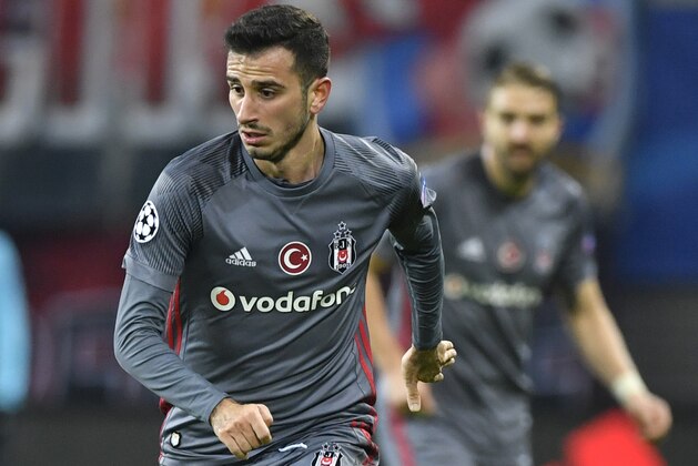 Besiktas' Turkish midfielder Oguzhan Ozyakup runs with the ball during the UEFA Champions League group G football match RB Leipzig vs Besiktas in Leipzig, eastern Germany, on December 6, 2017. / AFP PHOTO / John MACDOUGALL        (Photo credit should read JOHN MACDOUGALL/AFP/Getty Images)