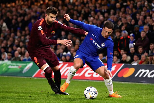 LONDON, ENGLAND - FEBRUARY 20:  Eden Hazard of Chelsea is challenged by Gerard Pique of FC Barcelona during the UEFA Champions League Round of 16 First Leg match between Chelsea FC and FC Barcelona at Stamford Bridge on February 20, 2018 in London, United Kingdom.  (Photo by Chris Brunskill Ltd/Getty Images)