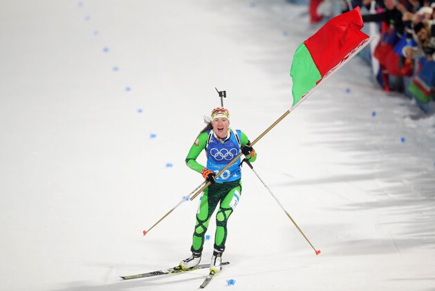 PYEONGCHANG-GUN, SOUTH KOREA - FEBRUARY 22:  Darya Domracheva of Belarus celebrates as she appraoches the line to win gold during the Women's 4x6km Relay on day 13 of the PyeongChang 2018 Winter Olympic Games at Alpensia Biathlon Centre on February 22, 2018 in Pyeongchang-gun, South Korea.  (Photo by Alexander Hassenstein/Getty Images)