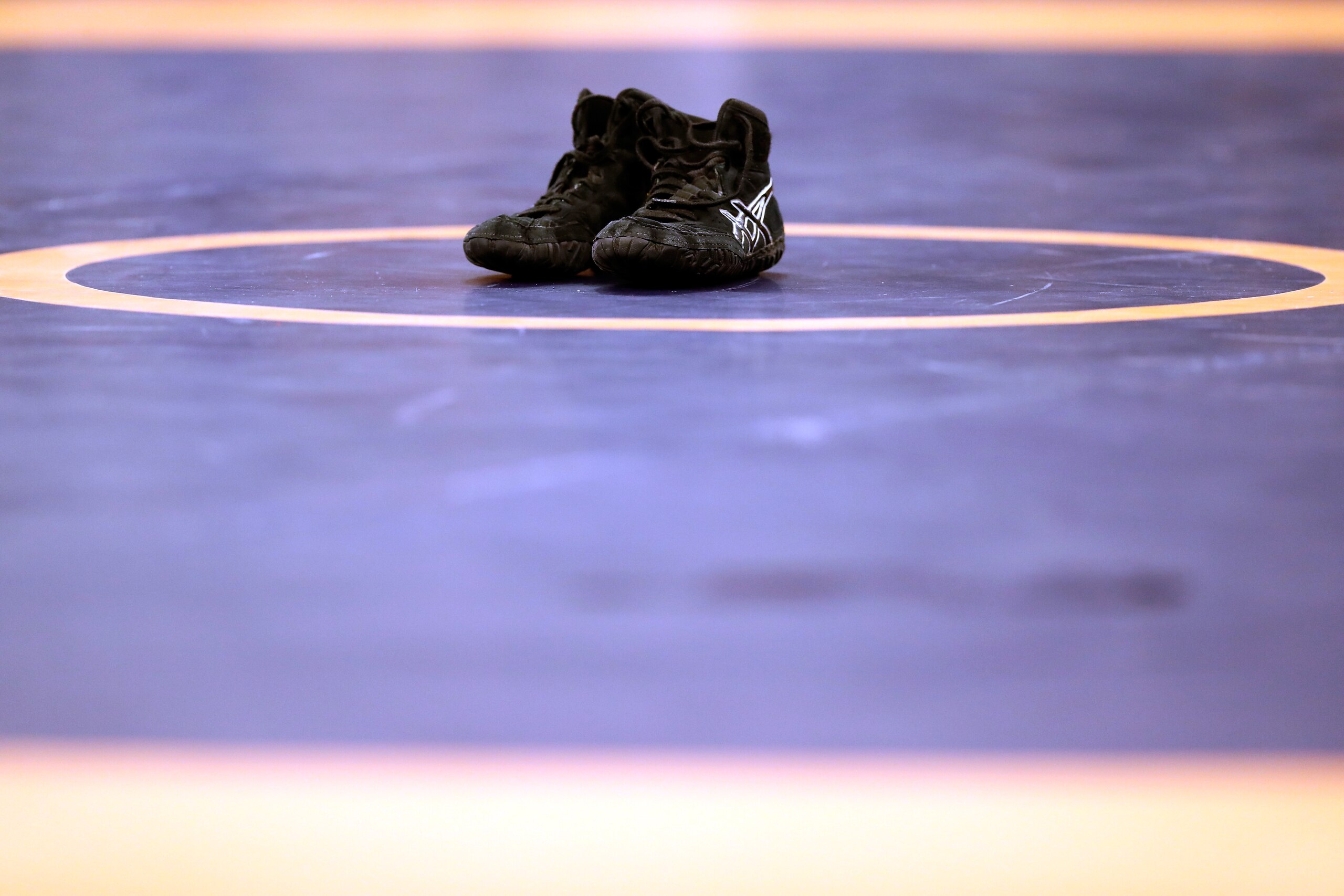 IOWA CITY, IOWA - APRIL 09:  Spenser Mango's  shoes are seen on the mat in retirement after losing his Greco-Roman 59kg semifinal match to Jesse Thielke during day 1 of the Olympic Team Wrestling Trials at Carver-Hawkeye Arena on April 9, 2016 in Iowa City, Iowa.  (Photo by Jamie Squire/Getty Images)