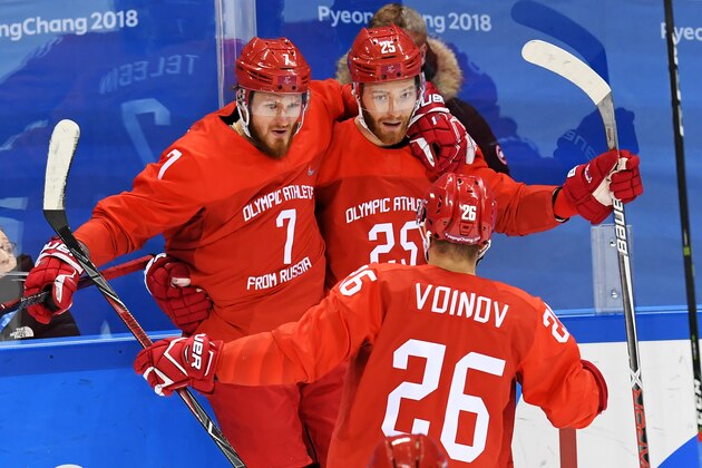 Russia's Mikhail Grigorenko (25) and Ivan Telegin (7) celebrate the first goal in the men's quarter-final ice hockey match between Norway and the Olympic Athletes from Russia (OAR) during the Pyeongchang 2018 Winter Olympic Games at the Gangneung Hockey Centre in Gangneung on February 21, 2018.   / AFP PHOTO / Kirill KUDRYAVTSEV        (Photo credit should read KIRILL KUDRYAVTSEV/AFP/Getty Images)