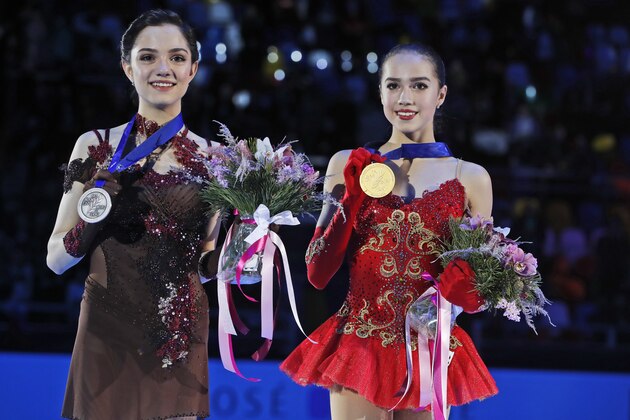 Russia's Alina Zagitova shows her gold medal, right, as she poses with Russia's silver medallist Evgenia Medvedeva after the ladies free skating event at the European figure skating championships in Moscow, Russia, Saturday, Jan. 20, 2018. (AP Photo/Pavel Golovkin)