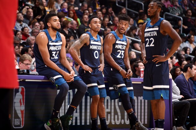 LOS ANGELES, CA - DECEMBER 25 Karl-Anthony Towns #32 Jeff Teague #0 Jimmy Butler #23 and Andrew Wiggins #22 of the Minnesota Timberwolves look on during the game against the Los Angeles Lakers on December 25, 2017 at STAPLES Center in Los Angeles, California. NOTE TO USER: User expressly acknowledges and agrees that, by downloading and/or using this Photograph, user is consenting to the terms and conditions of the Getty Images License Agreement. Mandatory Copyright Notice: Copyright 2017 NBAE (Photo by Andrew D. Bernstein/NBAE via Getty Images)