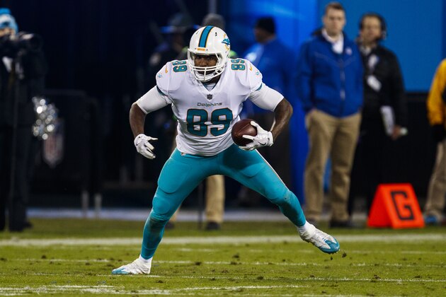 Miami Dolphins tight end Julius Thomas (89) runs the ball against the Carolina Panthers during an NFL game in Charlotte, N.C. on Monday, Nov. 13, 2017. (Chris Keane/AP Images for Panini)