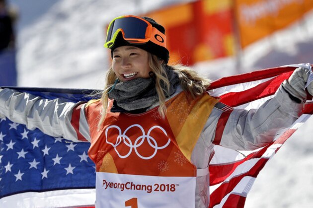 FILE- In this Feb. 13, 2018, file photo, Chloe Kim, of the United States, celebrates winning gold after the women's halfpipe finals at Phoenix Snow Park at the 2018 Winter Olympics in Pyeongchang, South Korea. Before Kim won gold in the snowboarding halfpipe event, her infectious personality and heartwarming origin story had already won her sponsorships from Toyota, Samsung, Visa and others. (AP Photo/Gregory Bull, File)