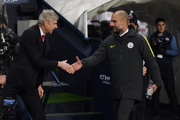 MANCHESTER, ENGLAND - DECEMBER 18:  Arsene Wenger, Manager of Arsenal (L) and Josep Guardiola, Manager of Manchester City (R) shake hands prior to kick off during the Premier League match between Manchester City and Arsenal at the Etihad Stadium on December 18, 2016 in Manchester, England.  (Photo by Michael Regan/Getty Images)