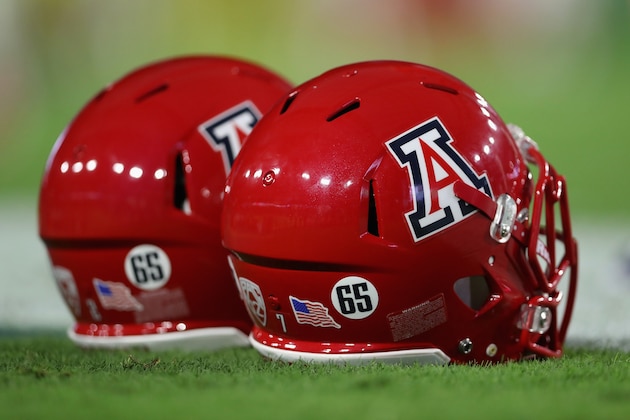 GLENDALE, AZ - SEPTEMBER 03:  Arizona Wildcats helmets display the #65 to honor offensive lineman Zach Hemmila who passed away in the off-season before the college football game against the Brigham Young Cougars at University of Phoenix Stadium on September 3, 2016 in Glendale, Arizona.  (Photo by Christian Petersen/Getty Images)