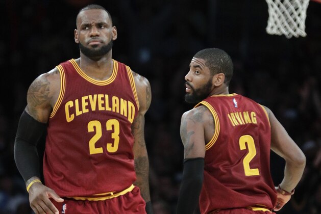 FILE - In this March 19, 2017, file photo, Cleveland Cavaliers' LeBron James, left, greets Kyrie Irving during the second half of an NBA basketball game against the Los Angeles Lakers in Los Angeles. There is bad blood once again in the NBA. No, it’s not just the Pistons-Bulls or Celtics-Lakers type of feuds. Sure, there’s Warriors-Cavs, Thunder-Warriors and Cavs-Celtics. But these days, it’s more individually driven _ thanks in large part to social media.  There’s Russ-KD, LeBron-Kyrie, and even a Whiteside-Embiid can get in on the action. The back-and-forth makes for matchups worth circling on the calendar _ beginning Tuesday night with Boston-Cleveland.  (AP Photo/Jae C. Hong, File)