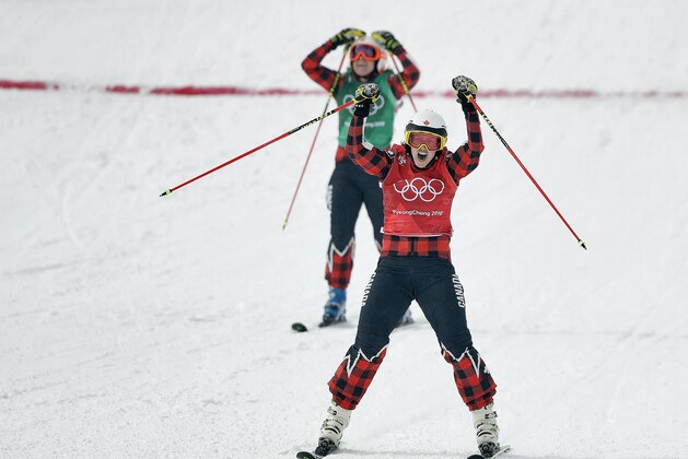 Gold medal winner Kelsey Serwa, of Canada, front, and silver medal winner Brittany Phelan, of Canada, cross the finish line during the women's ski cross final at Phoenix Snow Park at the 2018 Winter Olympics in Pyeongchang, South Korea, Friday, Feb. 23, 2018. (AP Photo/Gregory Bull)