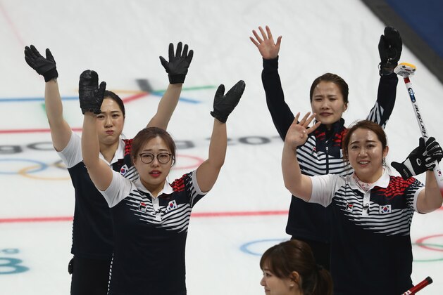 GANGNEUNG, SOUTH KOREA - FEBRUARY 23:  Korea celebrate after they defeated Japan during the Women's Semi Final match between Korea and Japan on day fourteen of the PyeongChang 2018 Winter Olympic Games at Gangneung Curling Centre on February 23, 2018 in Gangneung, South Korea.  (Photo by Robert Cianflone/Getty Images)
