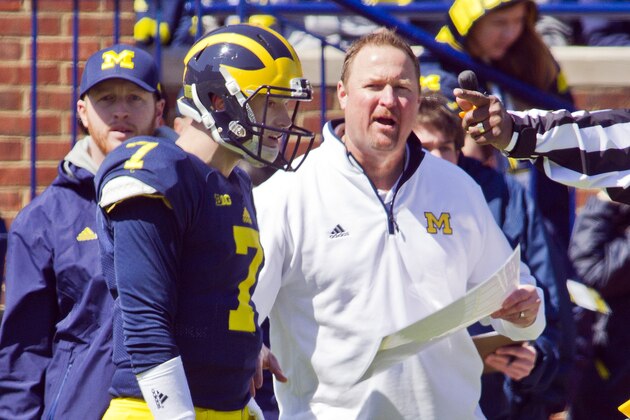 Michigan quarterback Shane Morris (7) listens to direction from offensive coordinator Tim Drevno, right, during the NCAA college football team's spring game in Ann Arbor, Mich., Saturday, April 4, 2015. (AP Photo/Tony Ding)