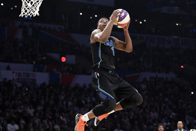 Dallas Mavericks' Dennis Smith Jr. competes in the slam dunk contest, part of the NBA basketball All-Star weekend, Saturday, Feb. 17, 2018, in Los Angeles. (AP Photo/Chris Pizzello)