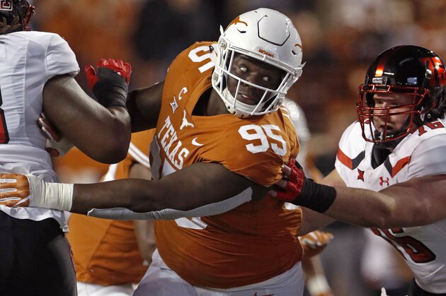 FILE - In this Nov. 24, 2017, file photo, Texas defensive lineman Poona Ford (95) rushes during the first half of an NCAA college football game against Texas Tech, in Austin, Texas. Ford was selected to the AP All-Conference Big 12 team announced Friday, Dec. 8, 2017. (AP Photo/Michael Thomas, File)