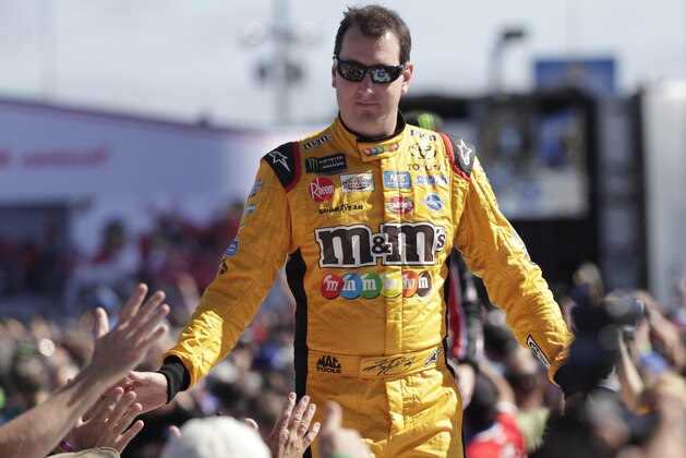 Kyle Busch greets fans as he is introduced before the NASCAR Daytona 500 Cup series auto race at Daytona International Speedway in Daytona Beach, Fla., Sunday, Feb. 18, 2018. (AP Photo/John Raoux)